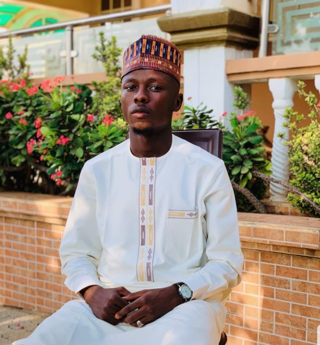 Sa'idu Abdulmumini Degri is a Nigerian figurative and environmental visual artist from Gombe State, Northern Nigeria. He holds a Bachelor's degree in Fine Art, with a major in Painting, from Ahmadu Bello University (ABU), Zaria. Deeply inspired by nature and socio-cultural realities, his work is rooted in storytelling, driven by a commitment to environmental and social advocacy.

Sa'idu’s practice blends impressionism and expressionism, combining both conventional & non-conventional media such as oil and acrylic, organic materials like charcoal lumps, tree bark, and branches. This experimental approach allows him to evoke powerful emotions while addressing pressing ecological and human issues. His art explores the fragile balance between the natural world and the destructive consequences of human actions; calling attention to climate change, deforestation, and environmental degradation.

Over the years, Sa'idu’s work has gained both national and international recognition. He is a recipient of a Gold Medal at the iCreate Africa Skills Fest Regional (Art Category, 2019) and an award winner in the Senior Drawing Category (2018). His work has been showcased in major exhibitions including the United Nations' Hope in Action Exhibition in Rome (2024), the UN SDG Action Campaign Art Exhibition in New York (2024), and the Nigeria Economic Summit Art Exhibition (2024). He has also exhibited at Art For Life in Helsinki, Finland (2024), Reflections on Childhood by The 34 Gallery(2024), the Kaduna Fashion Art Festival (2023), TEDx Kangiwa Book and Art Showcase (2021), and the Faculty of Environmental Design Exhibition at ABU Zaria (2019), among others.

Through his creative lens, Saidu seeks to inspire reflection, empathy, and collective action. His mission as an artist is to use visual storytelling not only to expose environmental and societal challenges, but also to promote sustainability, resilience, and hope, both in Nigeria and global horizon.
