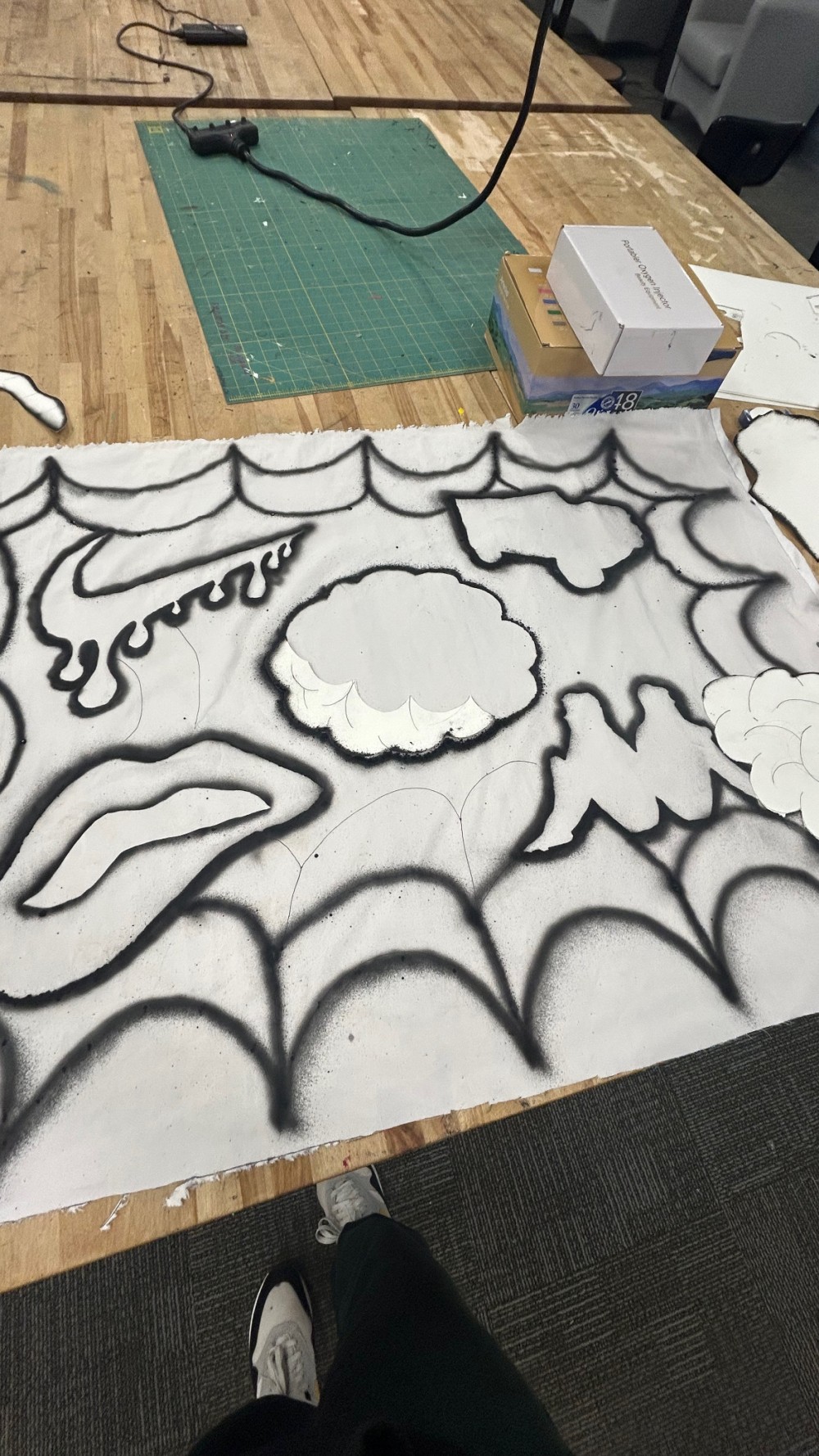 ‘Nike Swoosh’ , ‘Kappa’ , ‘Creative Brain Power’ , ‘Louis Vuitton’ , ‘Straight teeth clenching lip’ Credited designs caught in spider web’