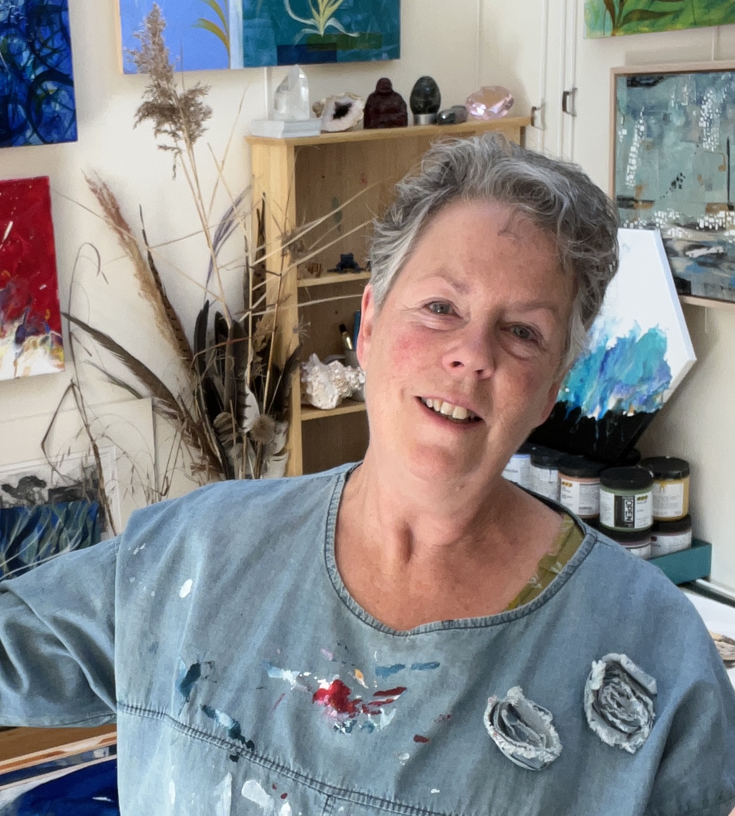 Although my interests are wide and varied, my current work aims to reflect a Piscean, avid cold water swimmer with an intrinsic affinity with, and love of, water in all its’ moods and vagaries; from a tiny raindrop to the vastness of a turbulent ocean.
Powerful experiences during scuba diving in my earlier years have also embedded deep memories of life and movement beneath the surface.  A ceiling of raindrops descending like musical notes into the deep is a wonder to behold and almost impossible to share.
Equally at home with collage, paint, print and textiles; I will use whichever media suits my need in the moment, often mixing several media in one piece.

Living on the edge of a small market town in Northamptonshire, most of my swims are in fresh water, but we visit Cornwall and Norfolk as often as we can; nothing beats sea swimming!
Coming back to my studio, memory fuels my ideas, the colour and movement feeding my soul and my work.