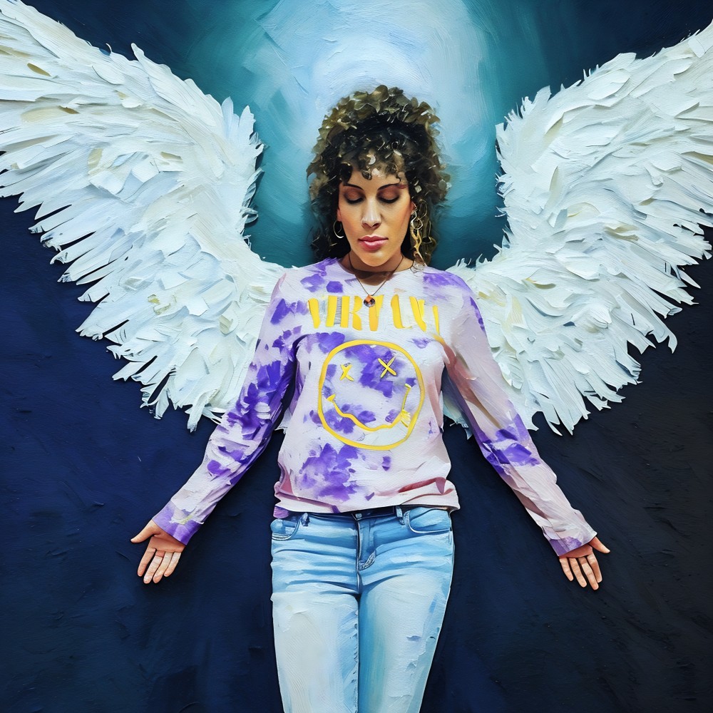 "Finding Nirvana: Earth Angel" actually has dual meaning behind it. It was a nod to my generation-Xennials. The band Nirvana was a loud voice for so many of us growing up. We were the end of Gen-X and the dawn of the Millennials. Our childhood was fueled by the independence of being latch-key kids and our teen years were infused with the emergence of major technological advances. 
On the other side of the dual meaning is a representation of myself as an earth angel. When you are healing and searching the depths of your inner world, you pull positive stories from the inner archives. It came to mind that there were so many occasions where people disclosed to me in conversations that I was their "Angel". Whether it was an act of bravery to literally save someone's life or as simple as words of wisdom I provided someone, there were so many times people told me I "saved" them in some way--almost as if I was an Angel sent to them at the perfect time-- Hence this representation.