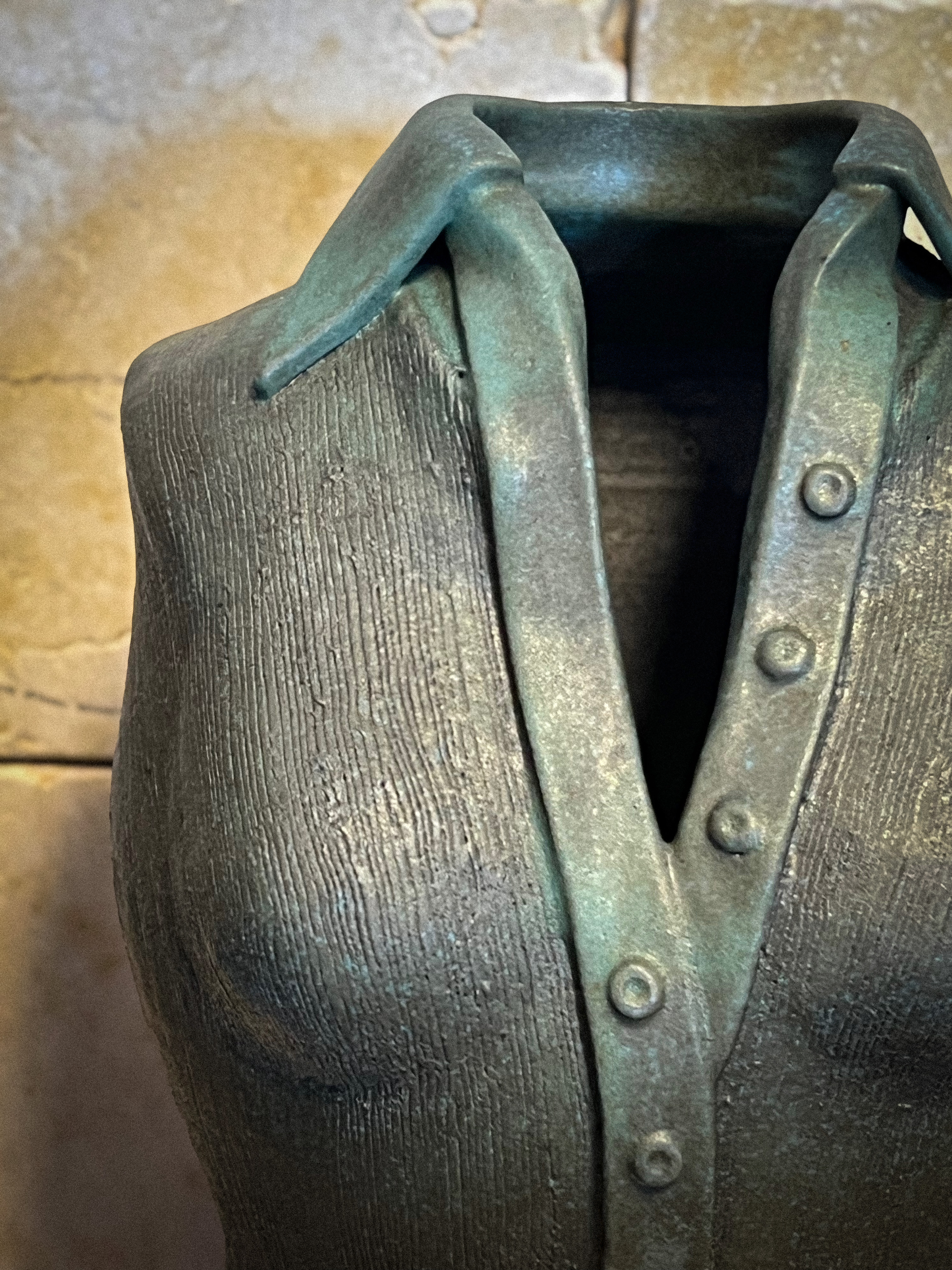I create ceramic sculptures that beautifully interpret our culture, memories, and desires through clothing. My works delve into how clothing conveys identity, emotions, and social status without directly depicting the person. Each piece reflects the individual's inner world, inviting viewers to complete a meaningful narrative.
Crafted through wheel throwing and meticulous handwork, my sculptures foster a dialogue between the viewer and the artwork. Through the form and materiality of each garment, I create a profound space that balances presence and absence, encouraging reflection on the human connections between body and clothing.
Driven by love for people, I aim to unveil the hidden memories and emotions within them. I inspire those who seek meaning in the unseen, reminding us that sometimes, absence is the most powerful part of the story.