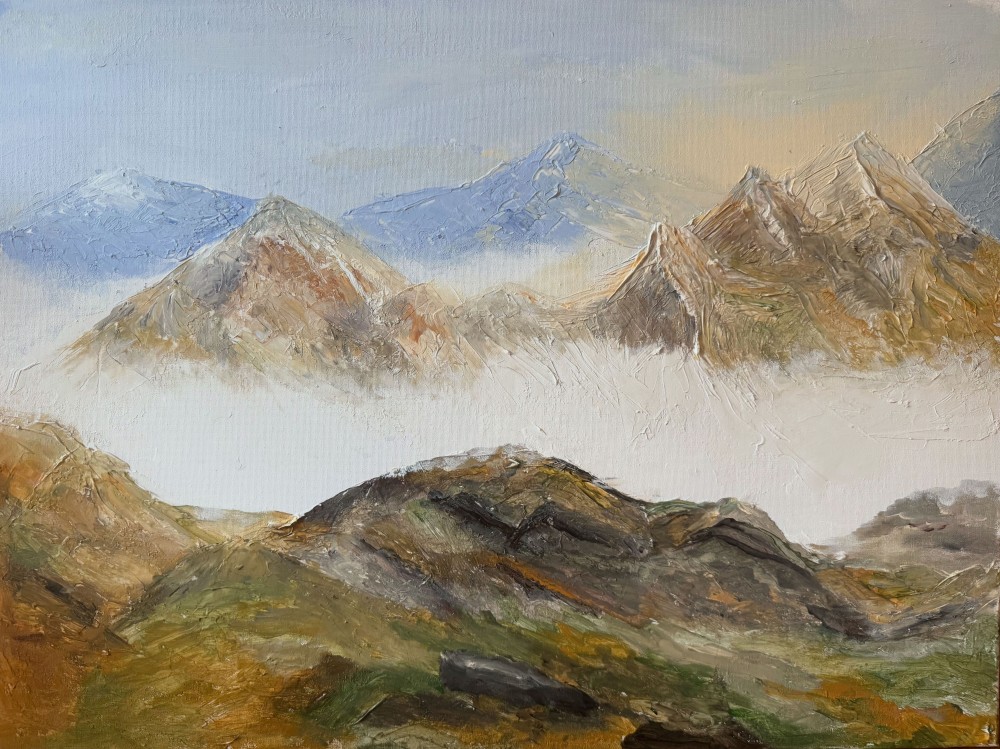 This painting appears to be an impressionistic landscape of a mountain range, created with thick, textured brushstrokes—likely using oil or acrylic paint. The scene features:



Foreground: Earthy greens and browns, depicting rolling hills and rocky outcroppings.
Midground: A layer of mist or clouds separating the foreground from the mountains, adding depth and atmosphere.
Background: Jagged peaks in warm ochres and browns on the right, and cooler blue and gray mountains on the left, giving a sense of distance and variation in lighting.
Sky: Softly blended hues of pale blue transitioning into warm beige, suggesting either early morning or late afternoon light.




The work uses impasto technique—thick paint application—to give the mountains a tactile, almost sculptural quality. The color palette balances warm earth tones with cool blues to create contrast and depth.