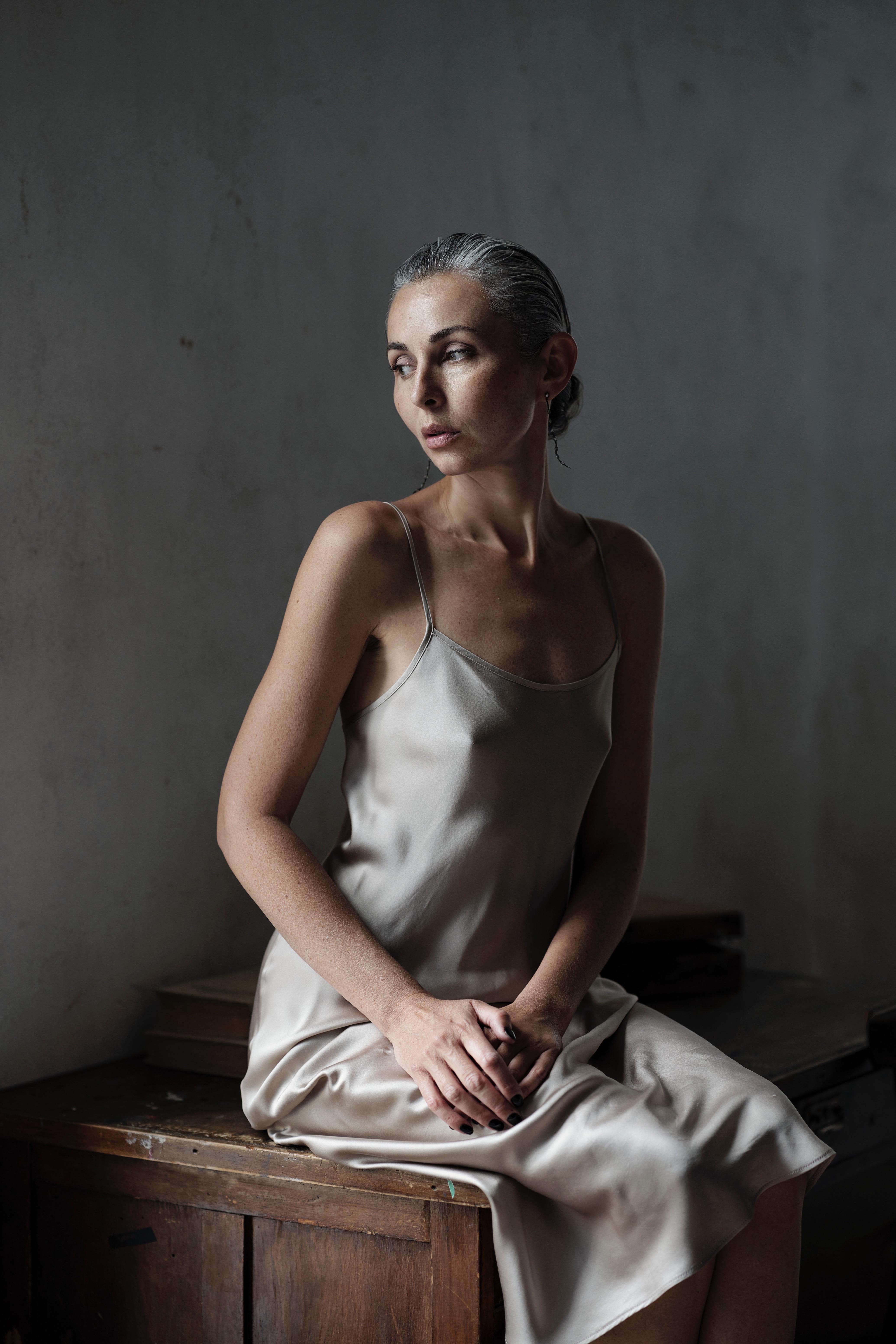 May name is Yana Lande. I am New York based artist. For me, artistic practice is the literal process of transposing meaning from the abstract world of ideas into material form: translating image into matter and endowing matter with image. This movement demands an extreme degree of mental and physical concentration, as each act of realization passes through the resistance of reality. Not every material can receive an idea and withstand its inner pressure.

As an artist, I am compelled to exist in two states at once: to be visible and remain unseen, to be heard without uttering a single word. 
I seek to create worlds that can be breathed into life not through direct declaration, but through presence itself. This tension shapes 
the way the image is realized through matter, pressure, and repeated physical action in Limelight. 

A central intuition in my method comes from the Ukrainian word 
for photograph—svitlyna—which literally means “born of light.” 
Both absolute radiance and absolute darkness produce disorientation. In my work, lime becomes the material embodiment of light: 
it absorbs the image and translates it into another state.

I construct the surface through repeated physical action. 
The brushstrokes register the very process of layering, establishing 
the picture plane as an autonomous field. Here, the reduction 
of the image intensifies rather than diminishes its force, increasing 
its conceptual density. The women at the center of this series 
are figures whose inner condition I perceive as a heightened form 
of clarity, concentration, and luminous power.