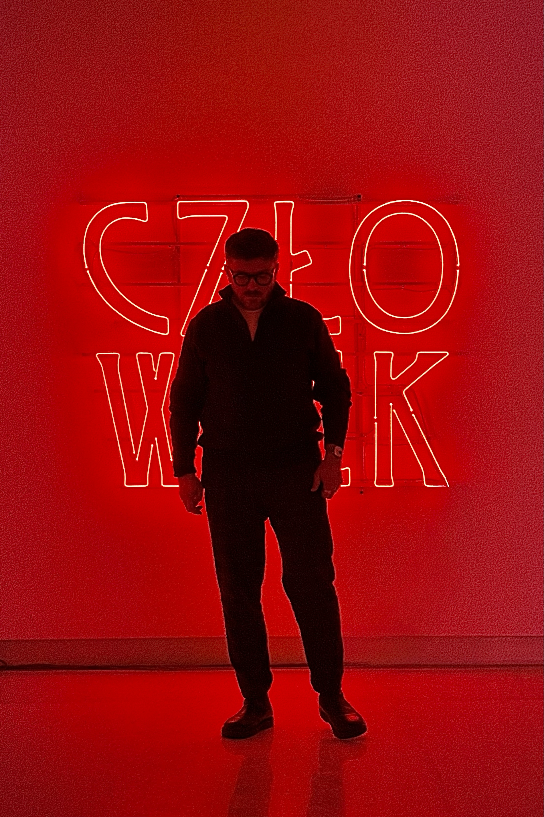 I am Marcin Wesołowski, a contemporary artist working at the intersection of iconic imagery, folklore, and personal mythology.

My practice draws from the visual languages of sacred art, folk traditions, and historical narratives, not as belief systems, but as cultural structures that have shaped how humans make meaning. 

I am particularly drawn to the symbolic power of religious iconography: its clarity, repetition, and emotional density. Though I am not religious, these images remain deeply human to me, charged with longing, fear, care, irony, and hope.

Travel has been a formative force in my work, sharpening my sensitivity to how different cultures encode similar human experiences through distinct visual grammars. Beneath this global perspective lies a strong local current: the Carpathian region, with its mystical folklore, woodcut aesthetics, animal symbolism, and quiet spirituality, continues to inform my visual imagination.

Alongside my artistic practice, I work closely with people as a mentor, educator, and through ongoing therapeutic training. Much of my daily life is shaped by listening: to stories, tensions, hesitations, unspoken meanings. 

When I close the door to my art room, I enter a different state. Solitude becomes absolute. In that quiet, voices return, not of individuals, but of places, memories, symbols, and half-remembered narratives. Creation becomes a form of listening turned inward.

Formally, my work often moves toward reduction: simple lines, limited palettes, distilled gestures allowing space for ambiguity and layered interpretation. Figures recur: saints without doctrine, devils without condemnation, animals as mirrors, old men as witnesses. These are not characters, but states of being.

Alongside my artistic life, I navigate the worlds of business and academia, where structure, responsibility, and decision-making are ever-present. Rather than opposing creativity, these experiences sharpen it. They inform my interest in boundaries, balance, and the fragile meeting point between order and vulnerability.

My work is not about answers. It is about presence.
A visual meditation on the human condition, where history, imagination, tenderness, and doubt meet.