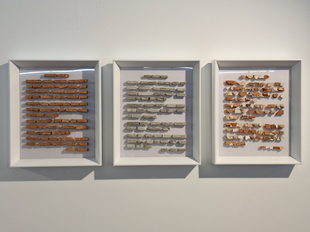 The starting point of the Transformation_1–2–3 series is inspired by Georges Didi-Huberman’s Shells (2018), in which fragments of tree bark collected from Auschwitz are treated as “letters of a pre-alphabetic script.” Similarly, this series brings together materials as textual elements—memory fragments bearing witness to a specific time and place.
In Transformation_2 and Transformation_3, found objects and earth shaped into adobe function as remnants of lived experience in Dikmen Valley. In Transformation_1, concrete—an emblematic material of capitalist urbanization—is used to construct the “text.” Through these material contrasts, the memory of a progressively disappearing landscape is archived and rendered permanent.