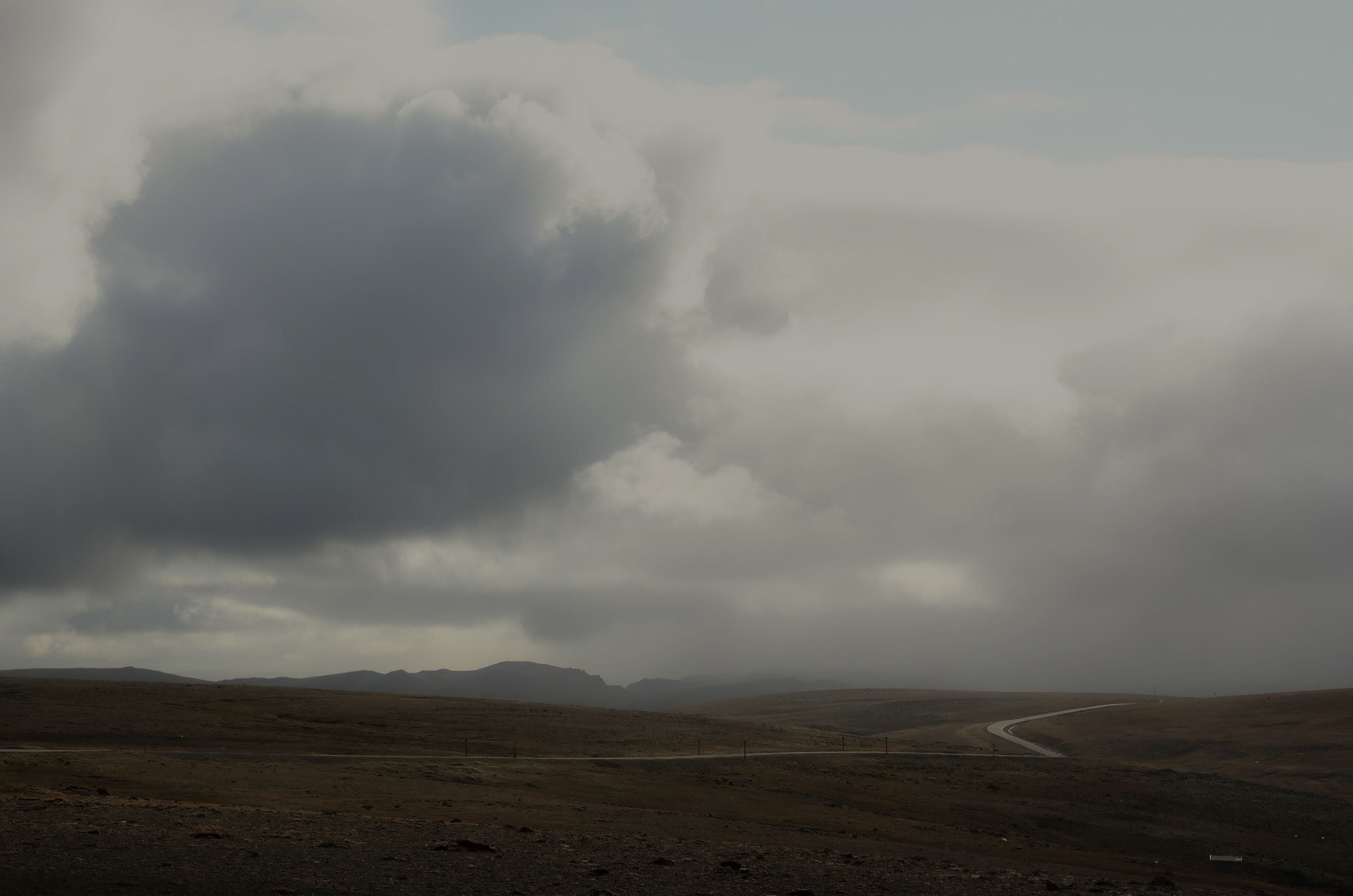 Erik Stenbeck’s photography is a personal exploration of the subtle and enduring connection between the human mind and the world it inhabits. Born in Norway in 1951, his academic background at the University of Oslo and Østfold College, along with early research on Edvard Munch, helped shape an artistic vision grounded in both reflection and observation.

For Stenbeck, photography is not merely a visual practice, but a way of engaging with existence as it reveals itself in fragments—through moments, places, and encounters. His images emerge from attentiveness rather than construction; they are found rather than staged. Whether working in black-and-white or color, he approaches each scene as an unfolding presence, where light, atmosphere, and form carry equal weight in shaping meaning.

His subjects range across landscapes, architecture, human figures, roads, forests, water, mountains—and the recurring presence of birds. These are not simply elements within a composition, but carriers of tension and meaning. A road becomes a line of thought, a building a trace of human intention, a figure a point of passage within a larger, indifferent whole. The birds, however, introduce another dimension: they appear as figures of power, distance, and awareness—at times external, at times internal, as if mirroring states of mind. They watch, hover, or withdraw, suggesting both control and vulnerability, instinct and reflection.

In color, subtle tonal shifts open new layers of perception; in black-and-white, the reduction reveals structure and essence. Together, they form a visual language that moves between clarity and ambiguity.

Central to Stenbeck’s work is an interest in the tension between presence and distance, between orientation and disorientation. His images often evoke a sense of stillness, where something appears both immediate and unreachable at once. Rather than offering conclusions, they hold space for uncertainty—suggesting that meaning is not fixed, but continuously shaped in the encounter between viewer and image.

Through this approach, Stenbeck’s photography becomes less about representation and more about resonance. It reflects a world that is at once external and internal, where perception itself becomes the subject. The recurring gaze—human or otherwise—creates a subtle dynamic of observation and being observed.

His work invites us to pause, to look again, and to consider how what we see is inseparable from how we experience being.