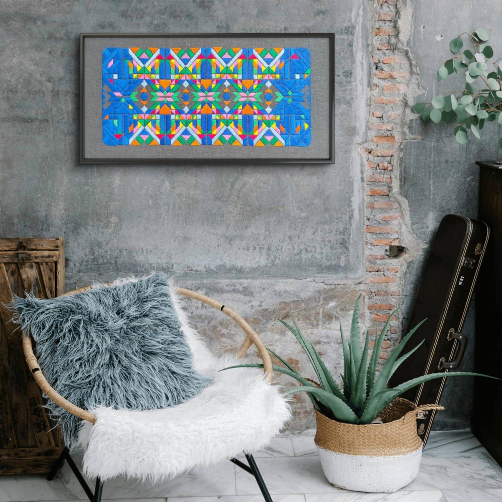 60 x 30 CM
This hand-embroidered piece on linen presents a captivating interplay of geometric forms and vibrant colors. Each stitch reveals a meticulous attention to detail, creating a rhythmic pattern that draws the eye and sparks the imagination. The bold blues, radiant pinks, and lively greens dance together, evoking a sense of movement and harmony.

The intricate design embodies a celebration of texture and color, inviting viewers to explore its layers and nuances. This artwork not only enhances your space but also serves as a conversation starter, reflecting a passion for craftsmanship and creativity. Perfect for those who appreciate the beauty of textile art, Tessellation No. 1 is a striking addition to any collection.