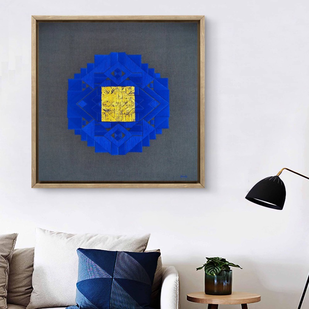 A unique piece that combines hand embroidery with 24-carat gold leaf on linen. This artwork presents a striking interplay of geometric forms in deep blue and gold, inviting contemplation and admiration.

Measuring 90 x 90 CM this piece is crafted with meticulous attention to detail, ensuring that each element contributes to its overall harmony. The rich textures and colors convey a sense of depth, making it a captivating focal point for any space.